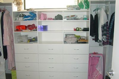 Create a bank of drawers for incredible storage in your walk in wardrobe